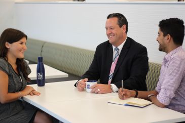 Brien Convery of RBC meeting with mentorees