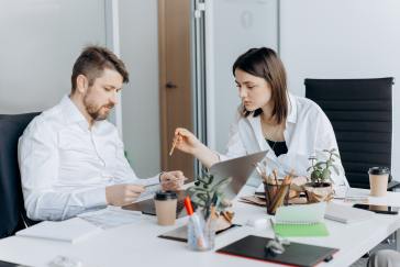 Coworkers reviewing work