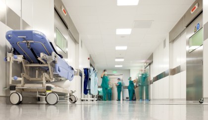 A hospital corridor with healthcare providers.