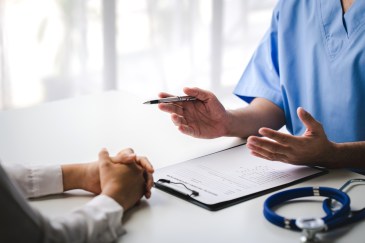 Doctor explaining something to a patient