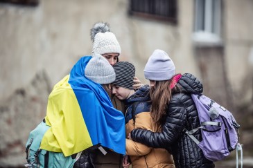 A Ukrainian mom and her three children huddled together.