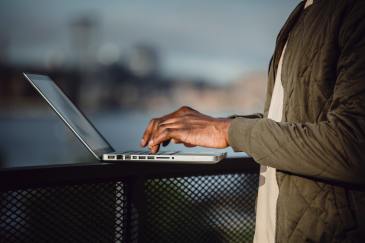 Typing on laptop