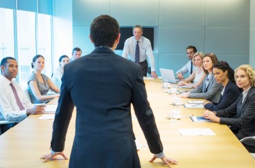 Employees in conference room discussion