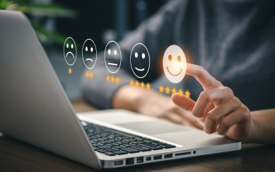 A person clicks on a smiley face with five stars underneath it.