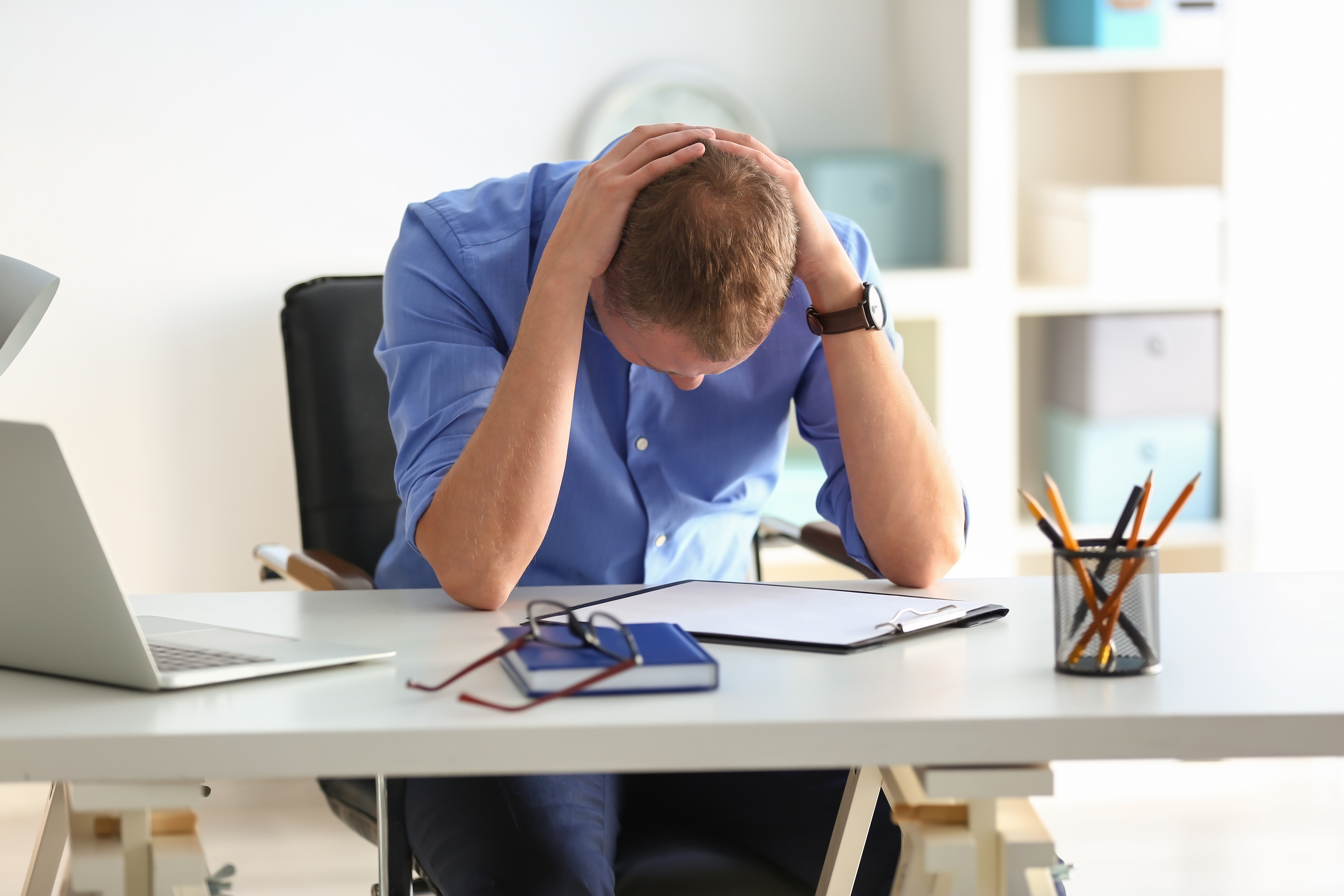 Employee with head in his hands