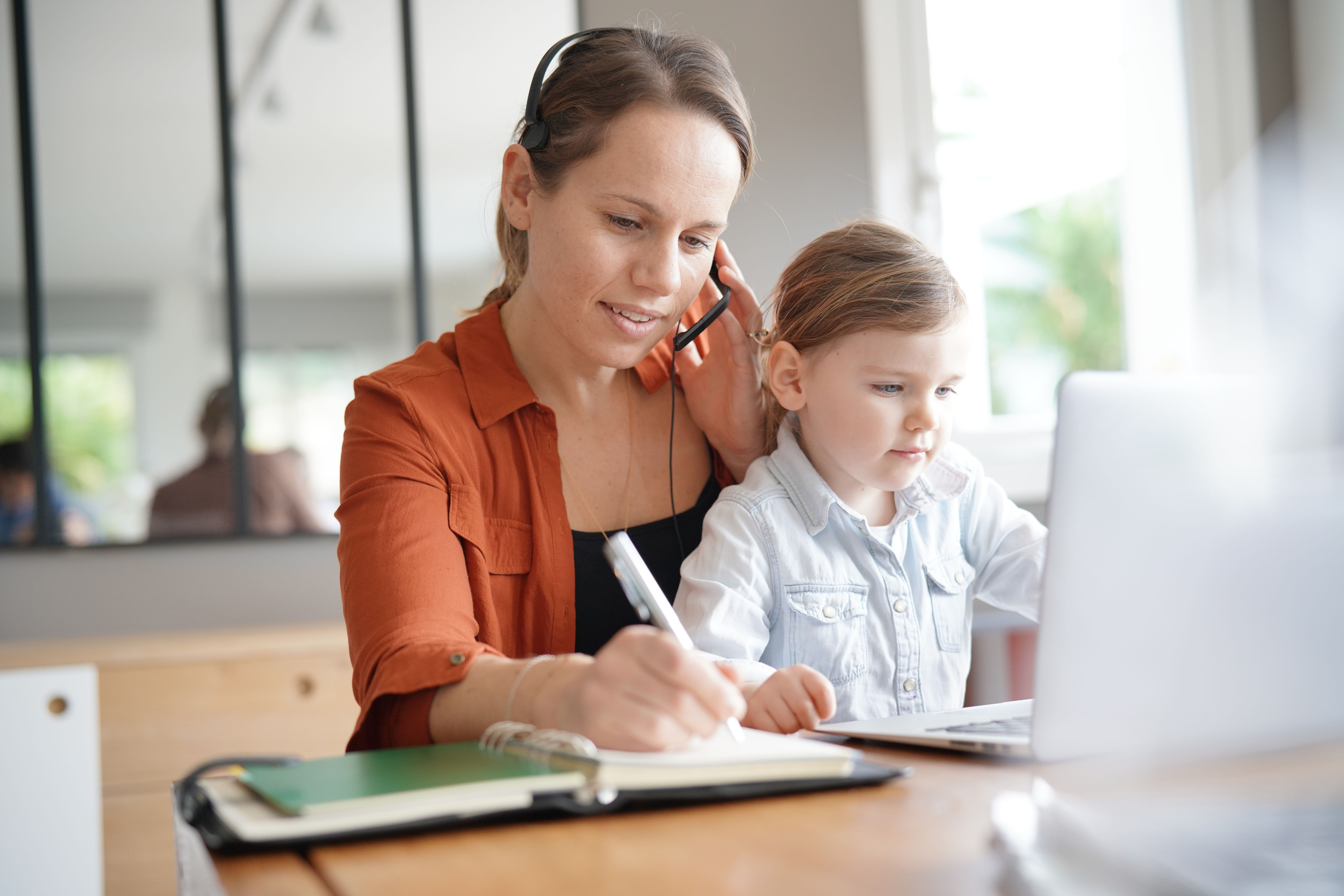 Mom working with child in lap
