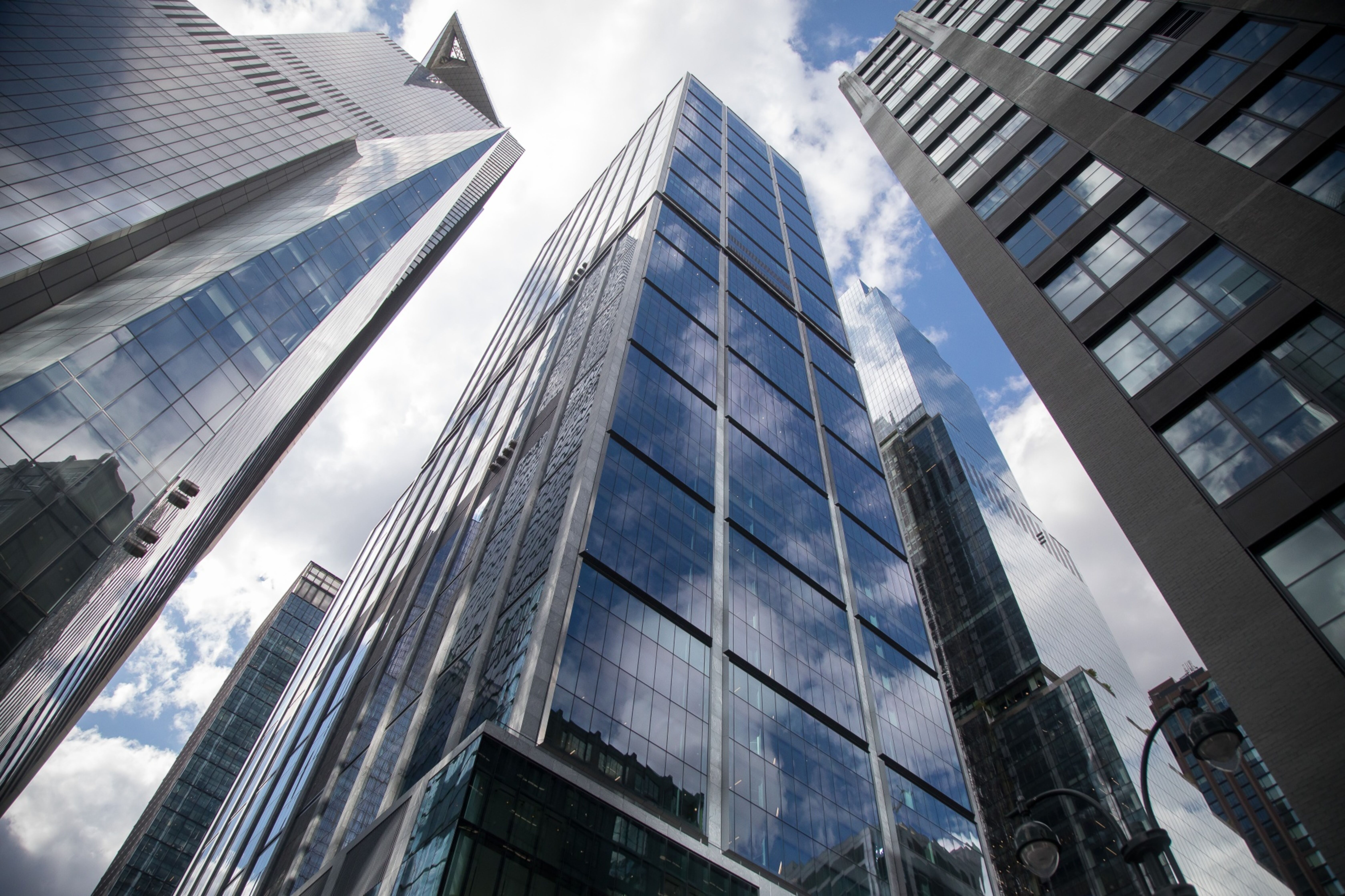 BlackRock headquarters in New York -- tall, glass skyscraper pictured from the ground.