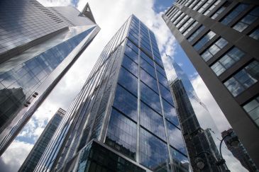 BlackRock headquarters in New York -- tall, glass skyscraper pictured from the ground.