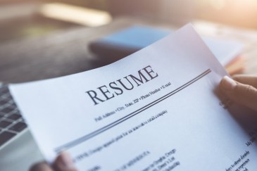 Someone holding a resume