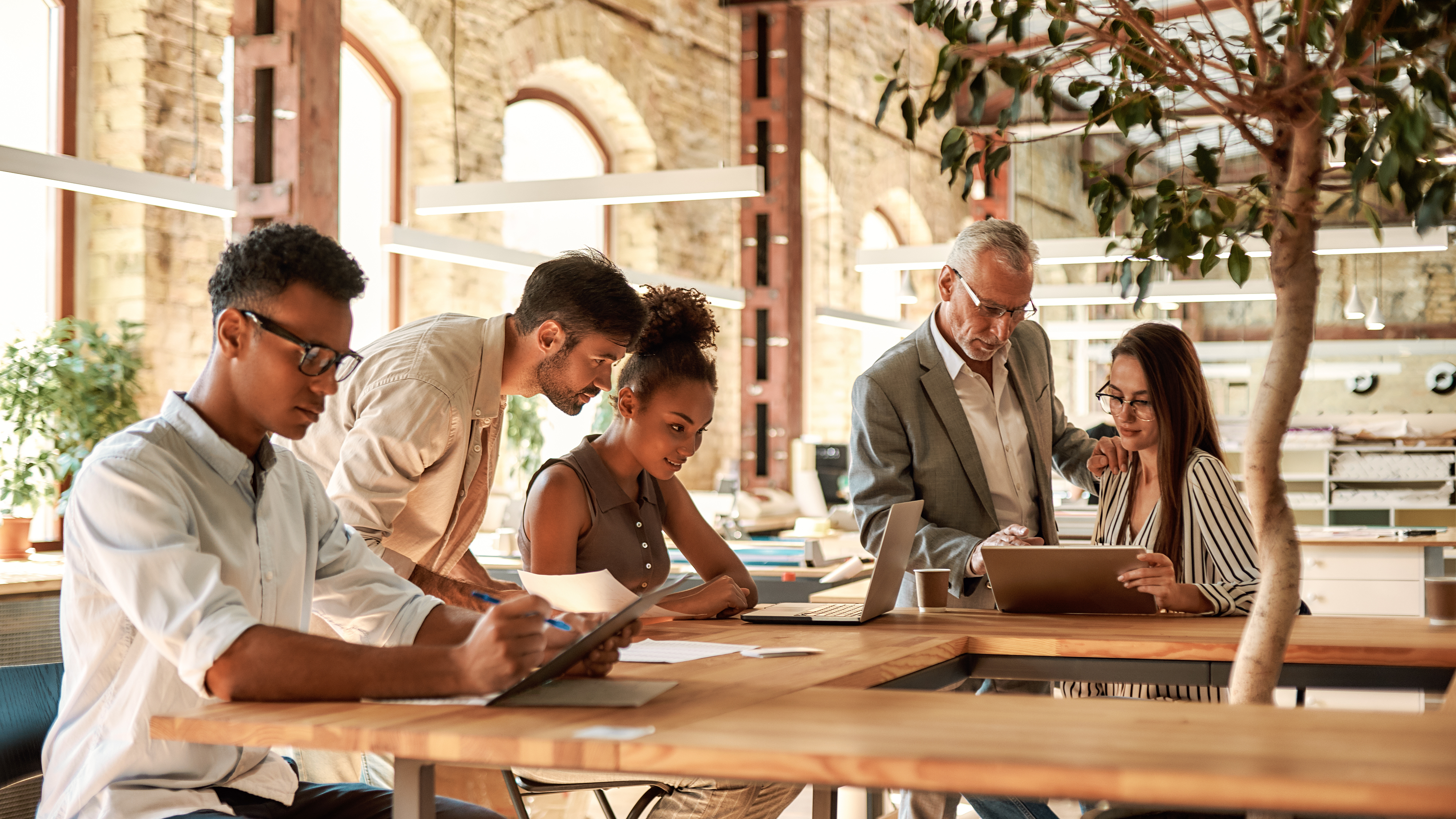 Employees working together in office