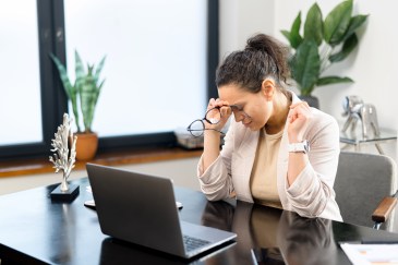 Employee stressed with laptop