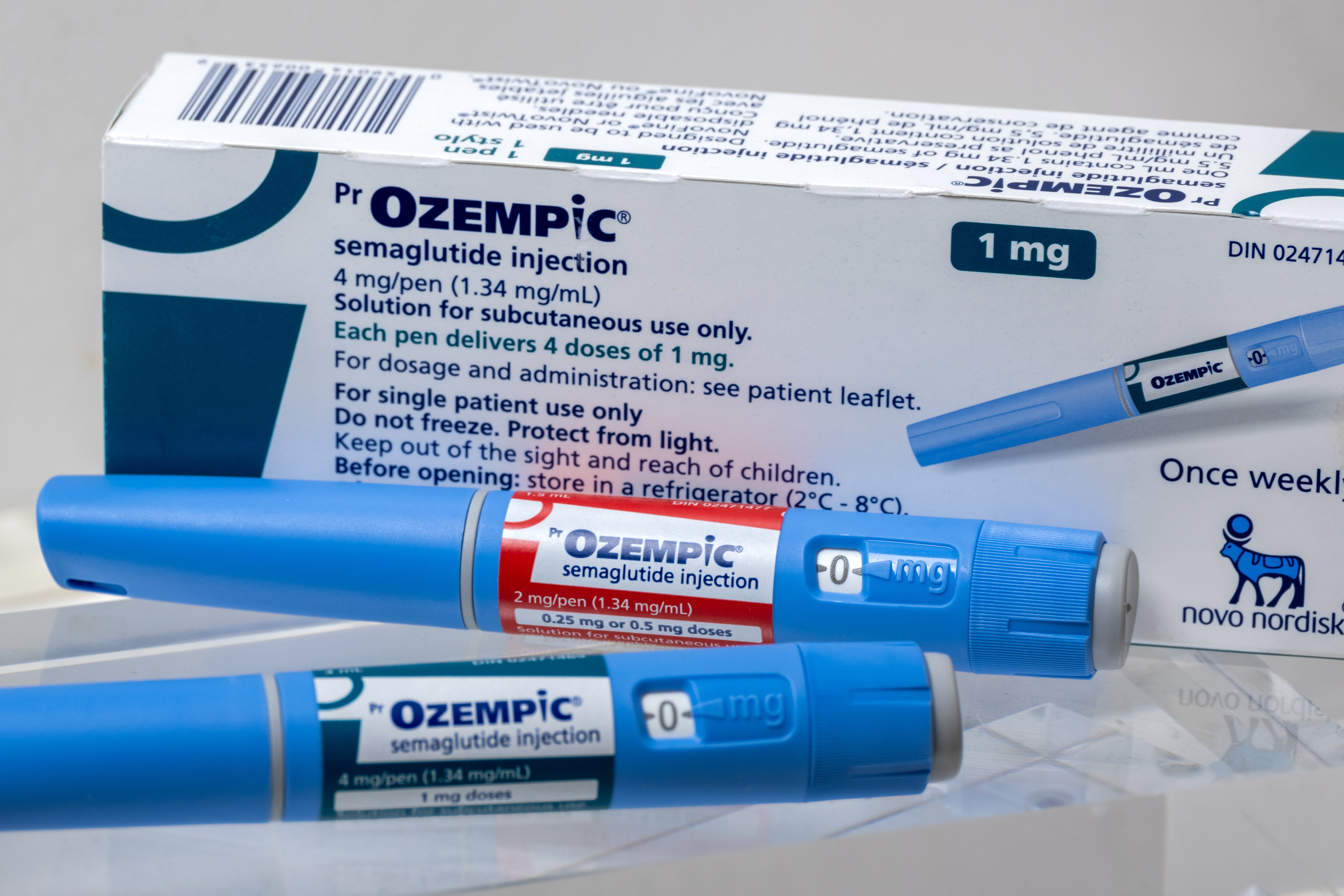 Two Ozempic injection pens and the box.