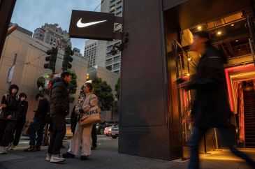 Exterior of a Nike store with the logo on the sign
