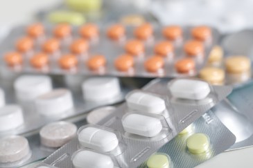 Various types of prescription drugs on a table top