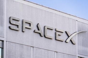 SpaceX logo on a gray building.