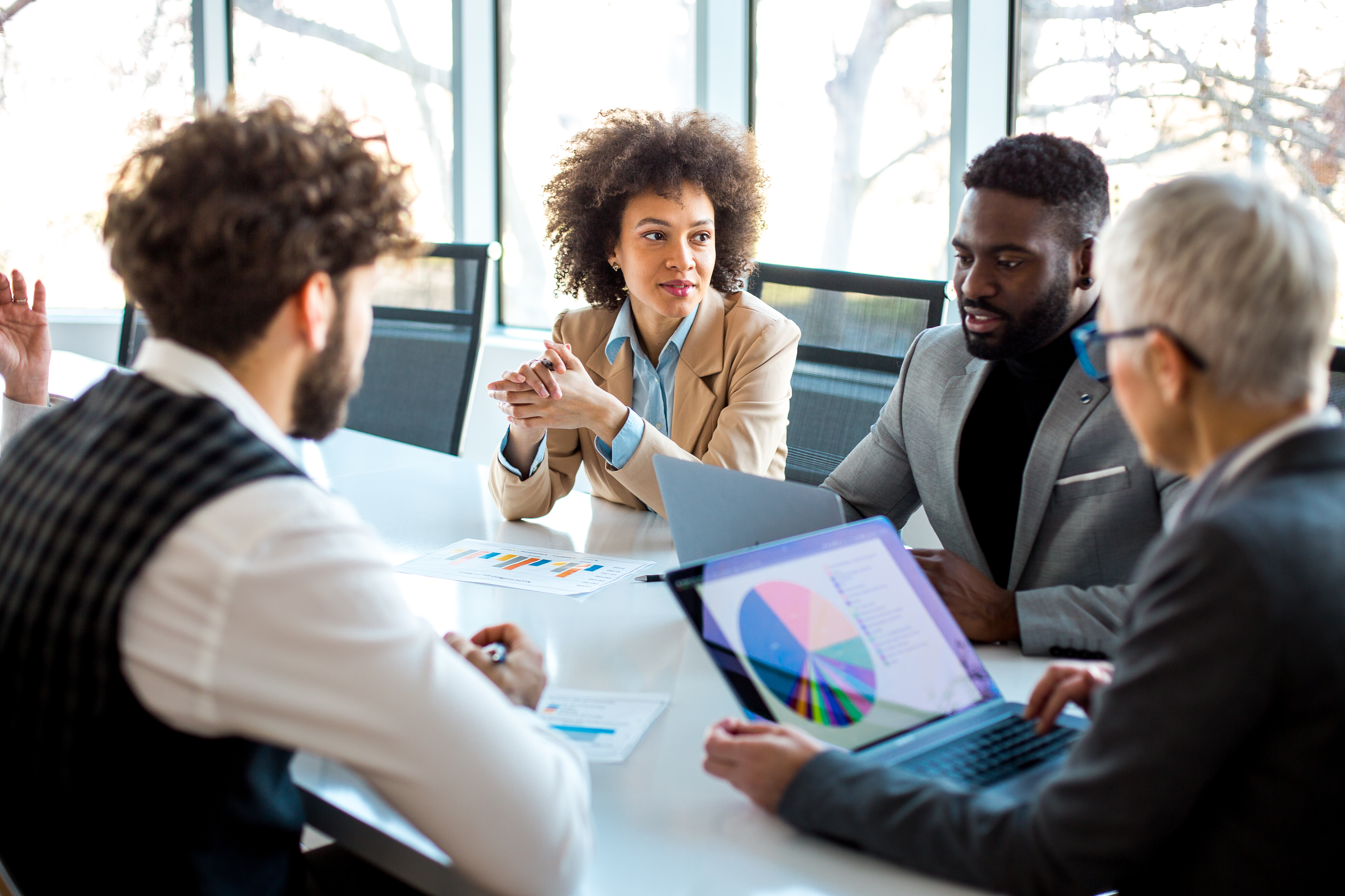Employees in conference room talking
