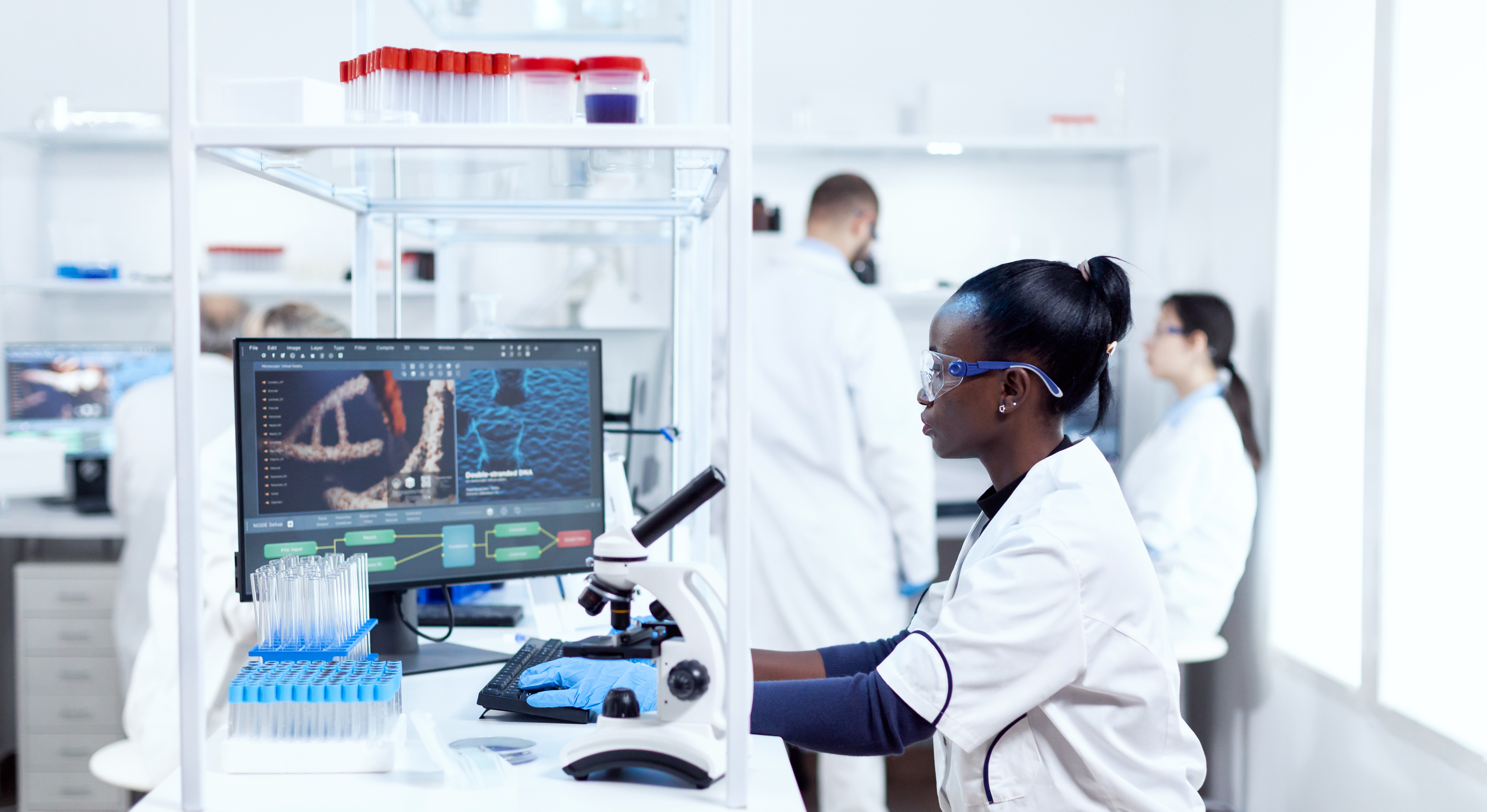 Researchers working in lab with computers