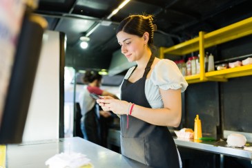 Food service industry worker on phone