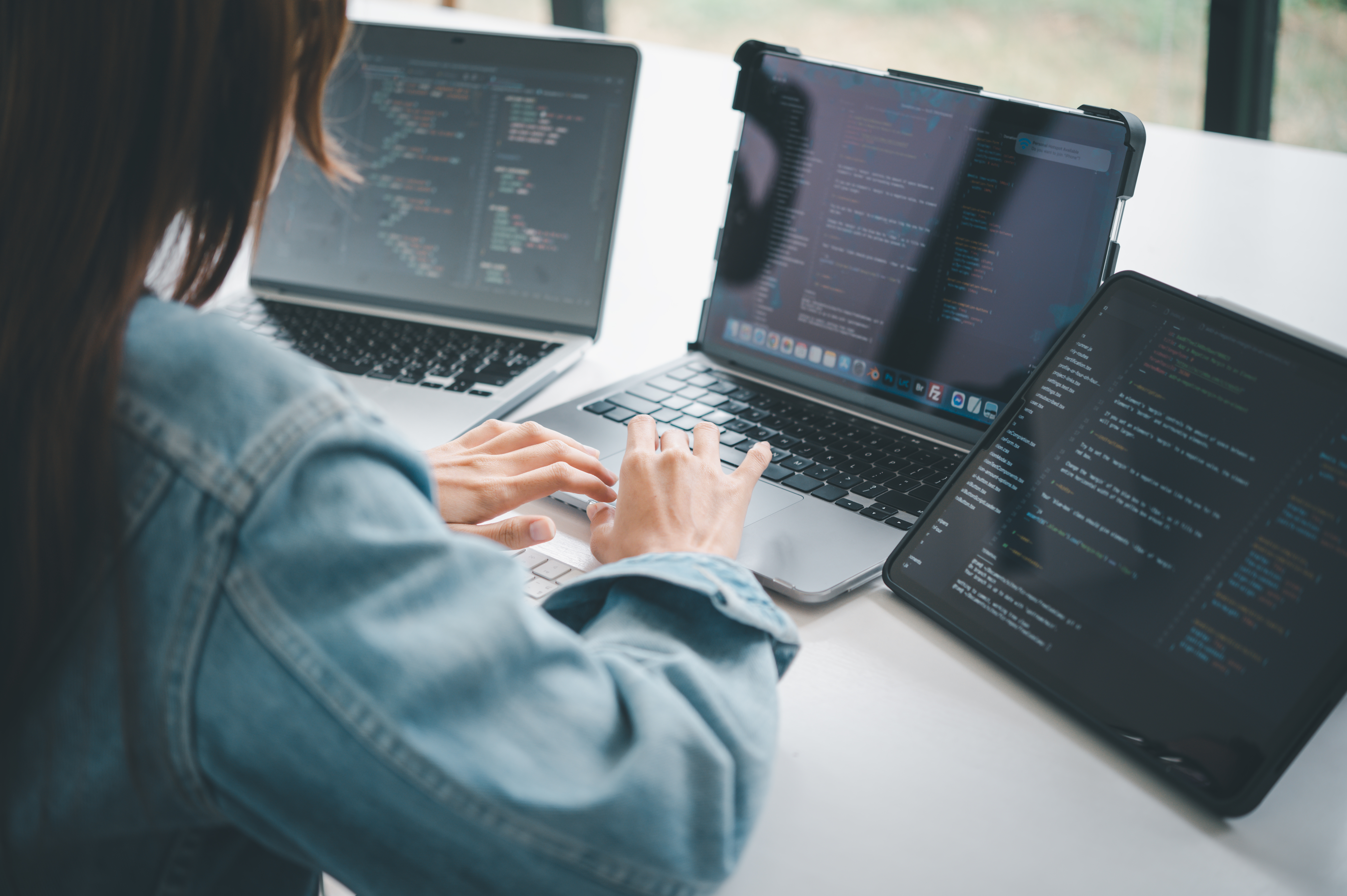 Woman coding on the job.