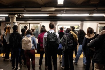People waiting for the train on their morning commute