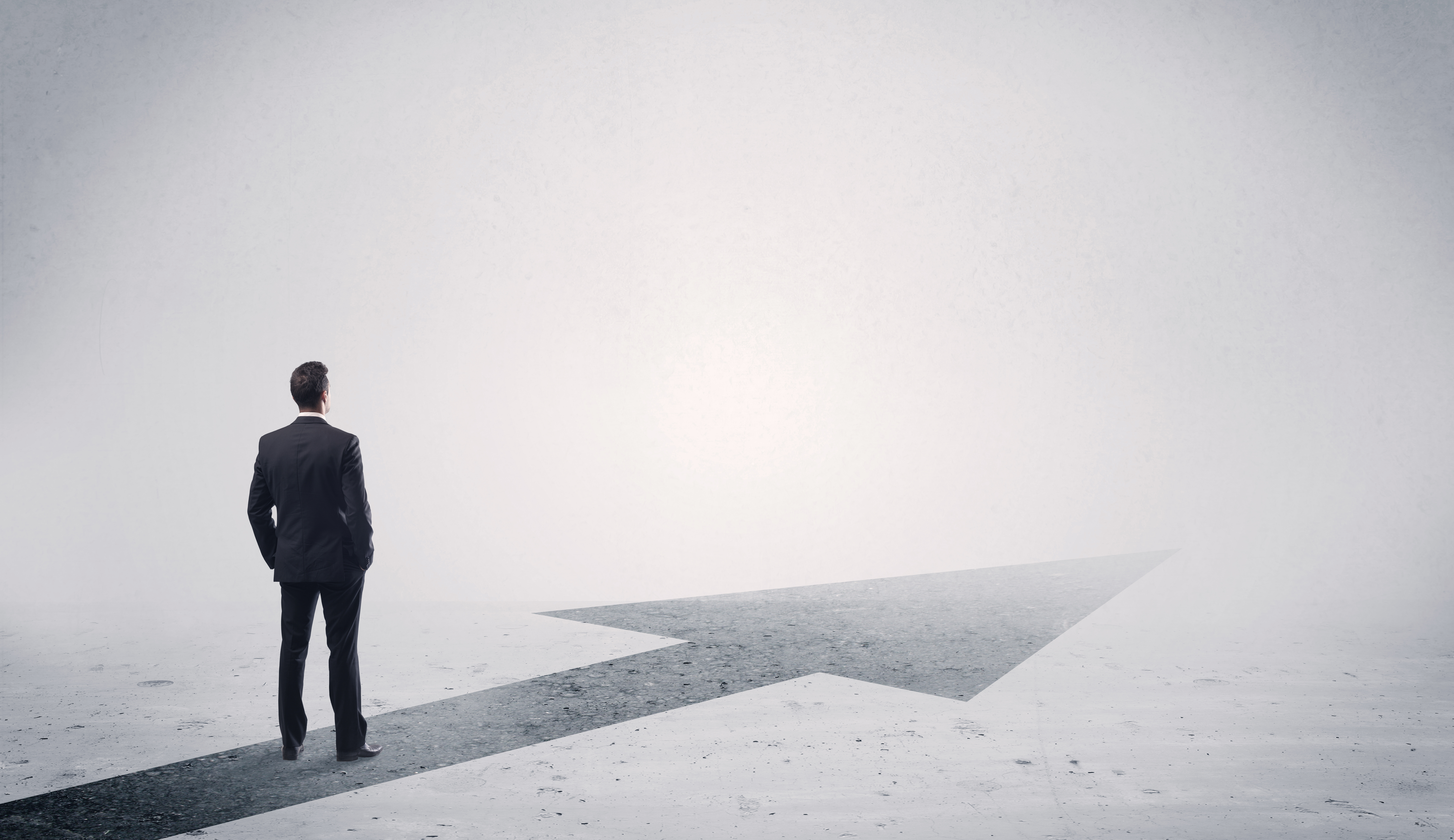 Man standing on forward arrow