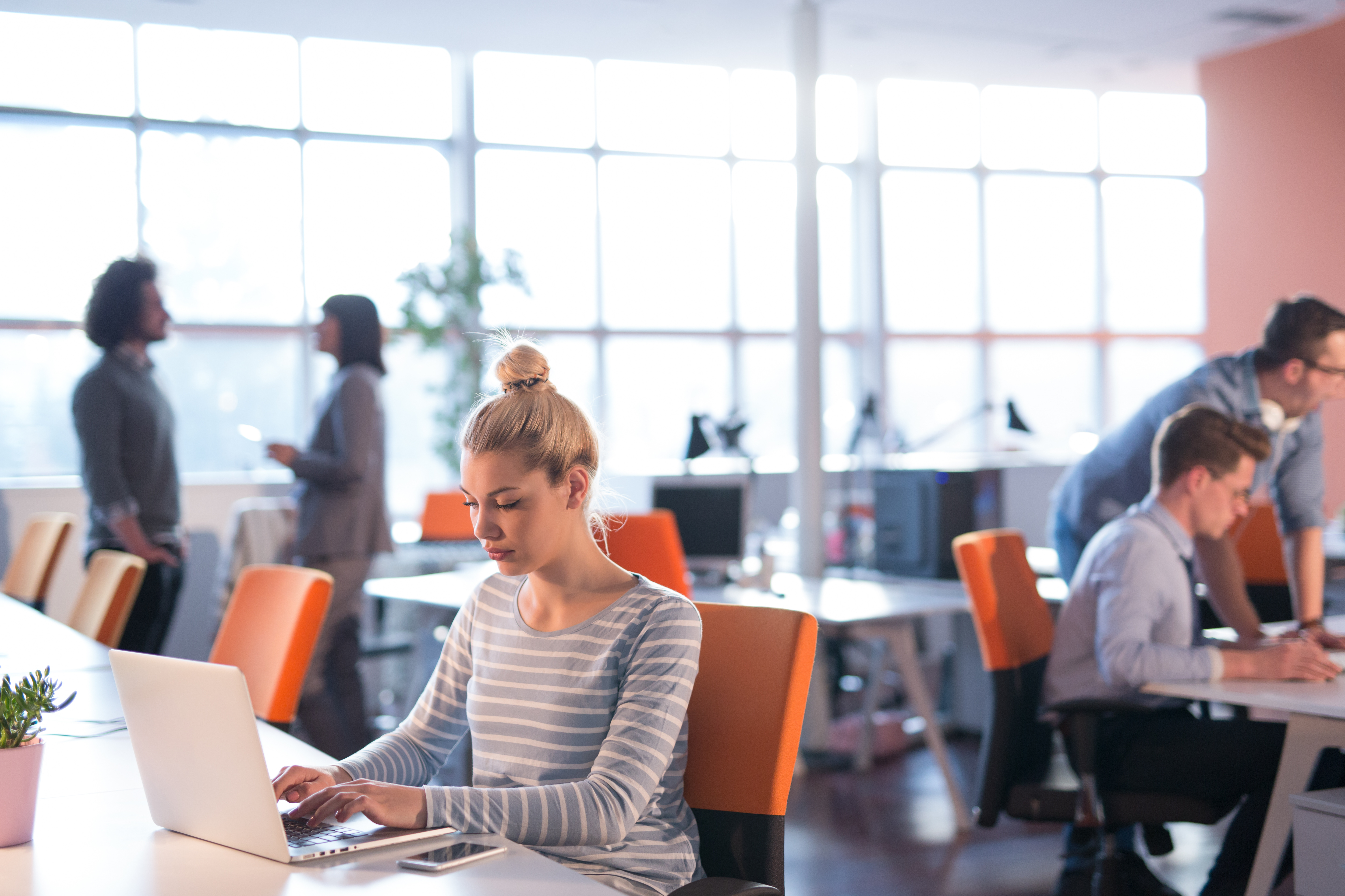 Employees working in-office.