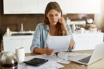 Woman stressed about bills.