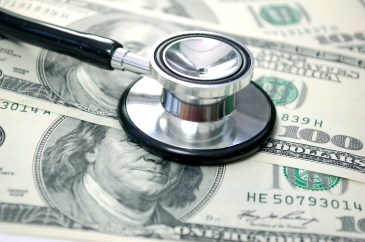 $100 bills with a stethoscope on top