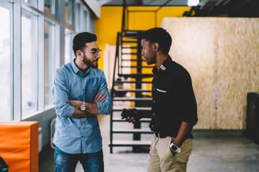Two employees engaging in conversation.