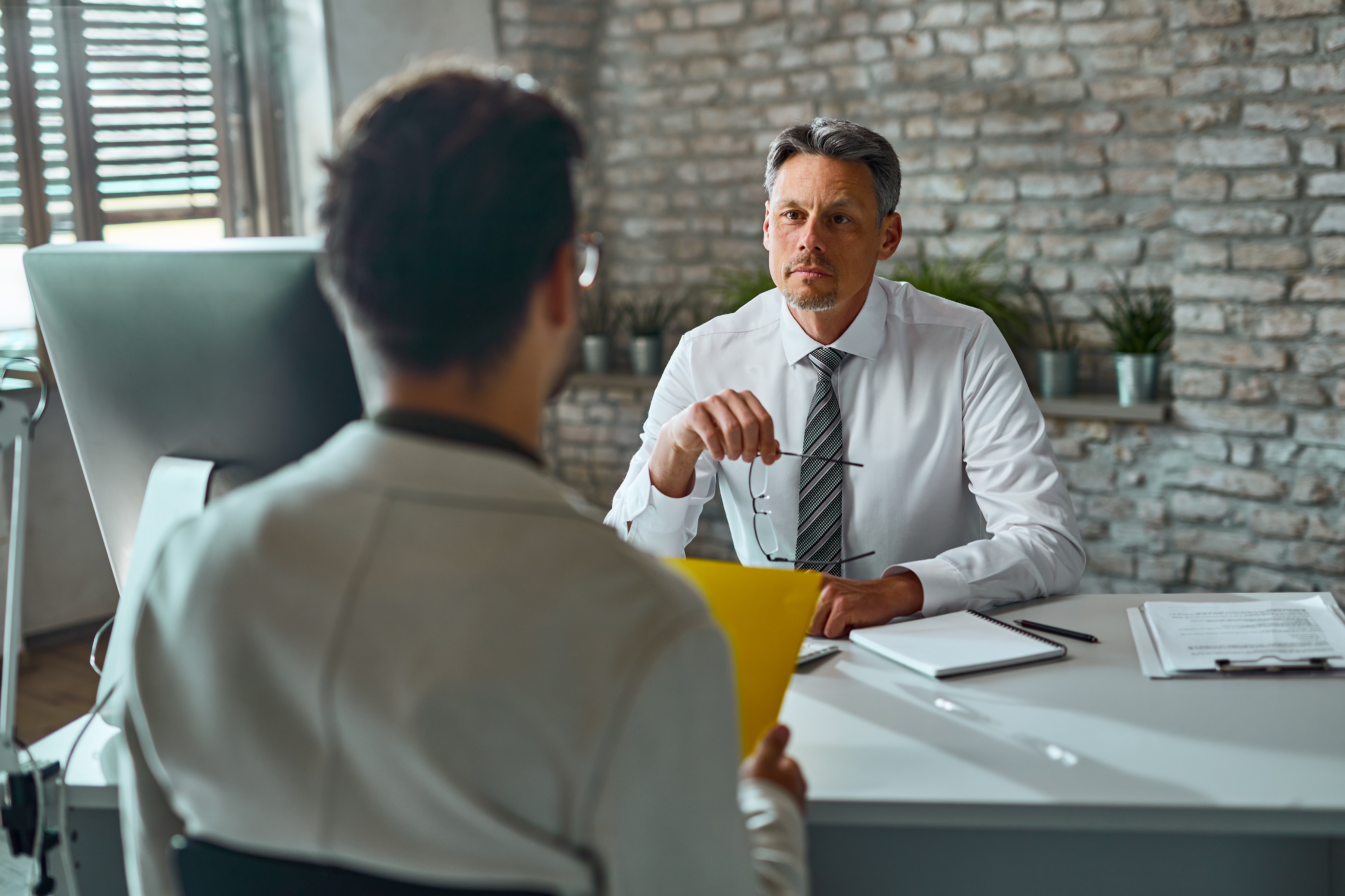 Man sitting in an interview.