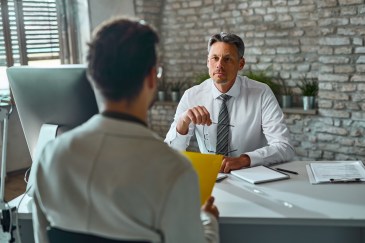 Man sitting in an interview.