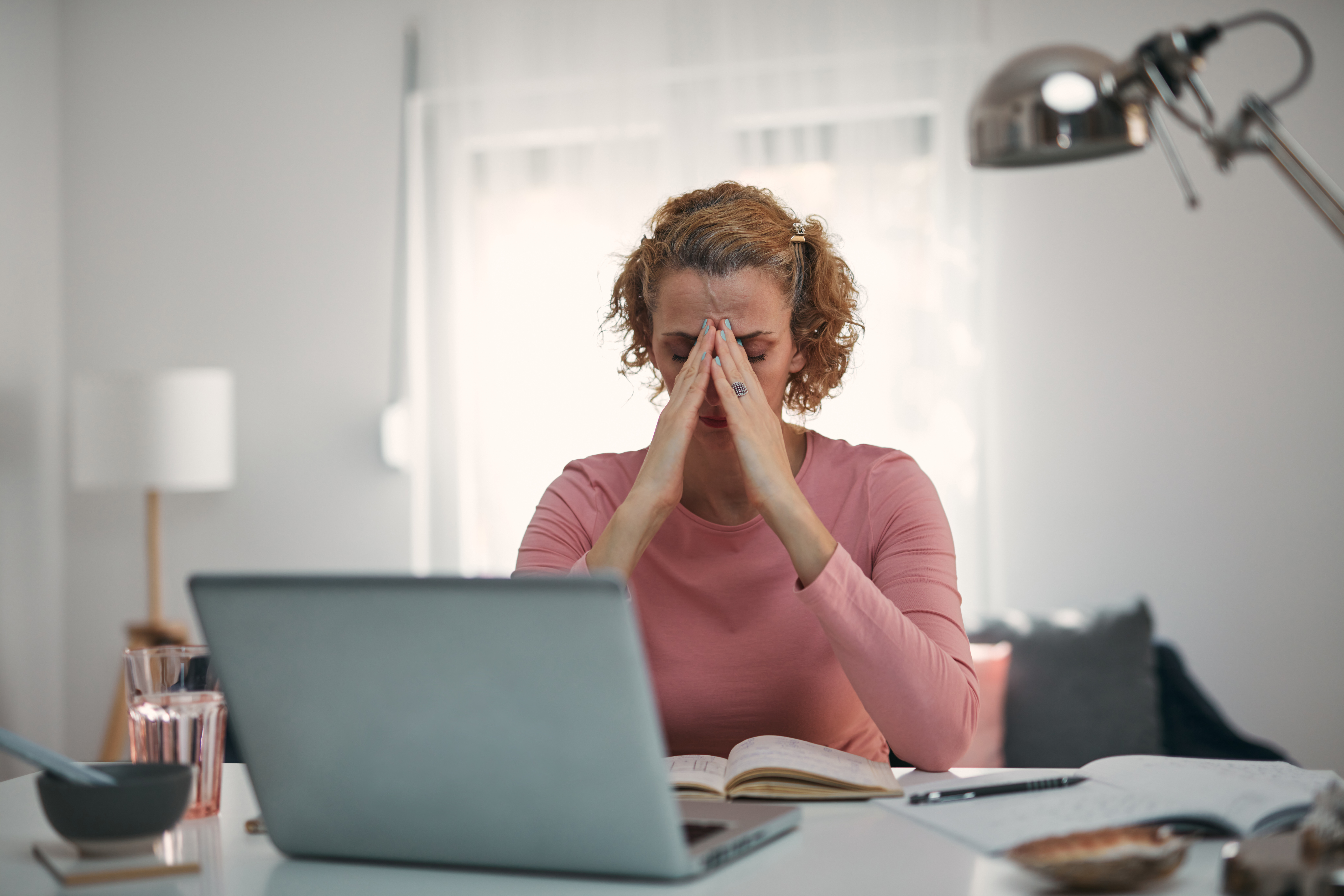 Woman looking upset while sitting in front of her computer