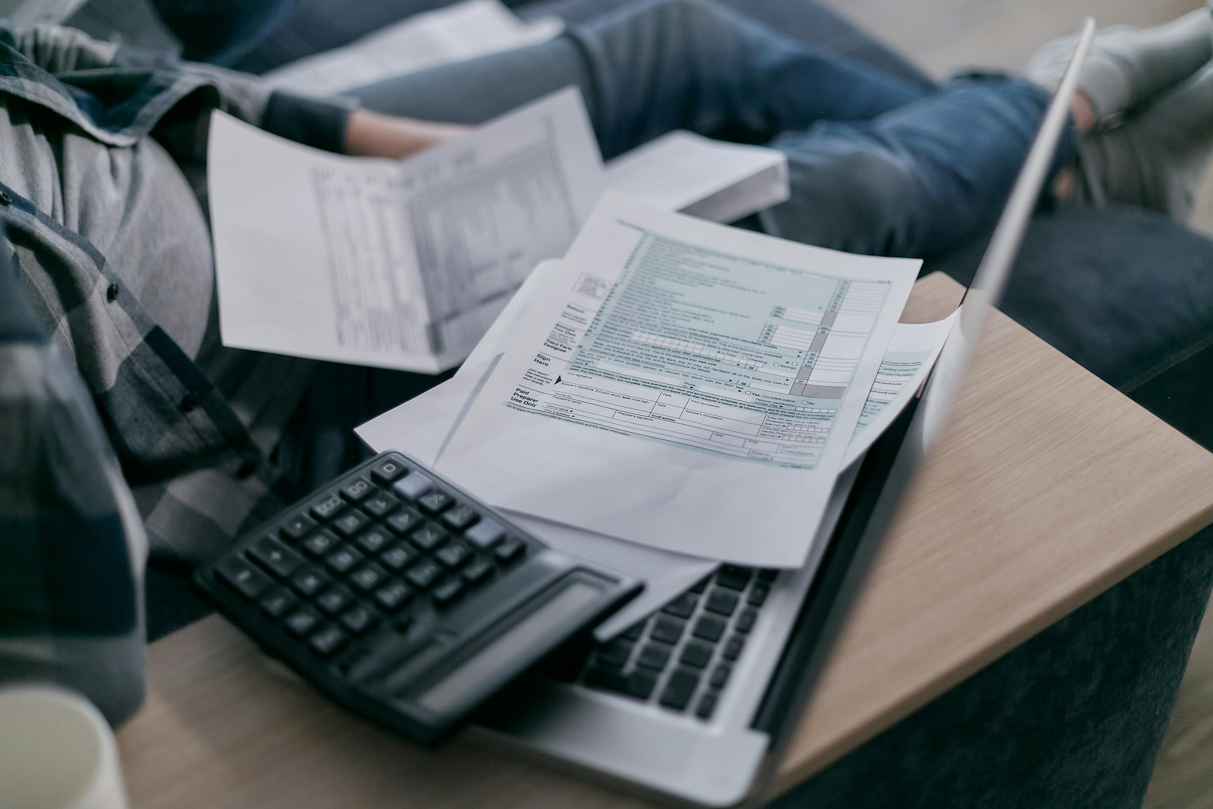 A man trying to fill out financial documents.