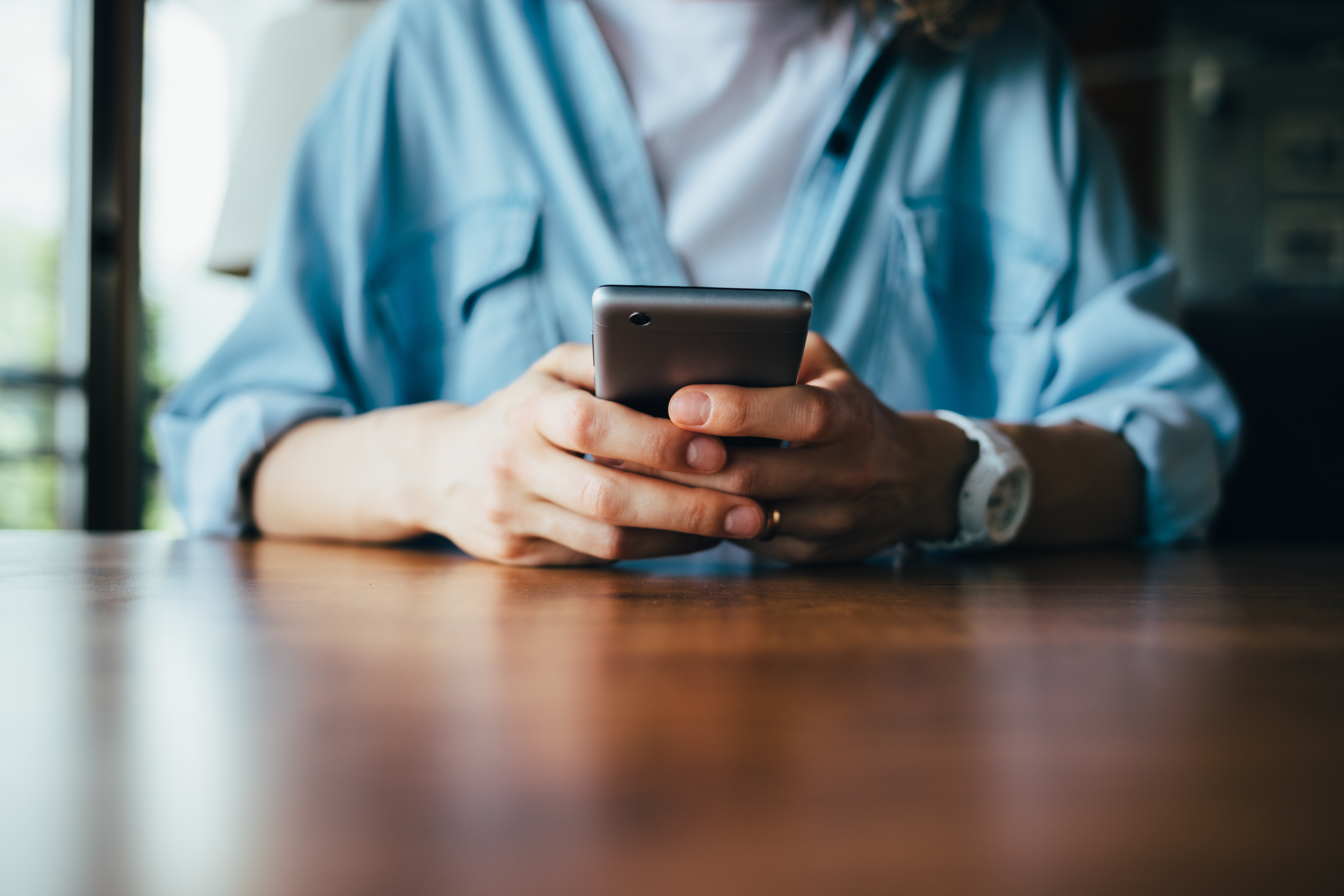 Man texting on his cell phone