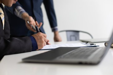 Employee signing a contract