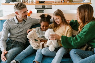 Parents with their adoptive children.