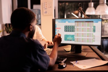 Man working at computer analyzing data