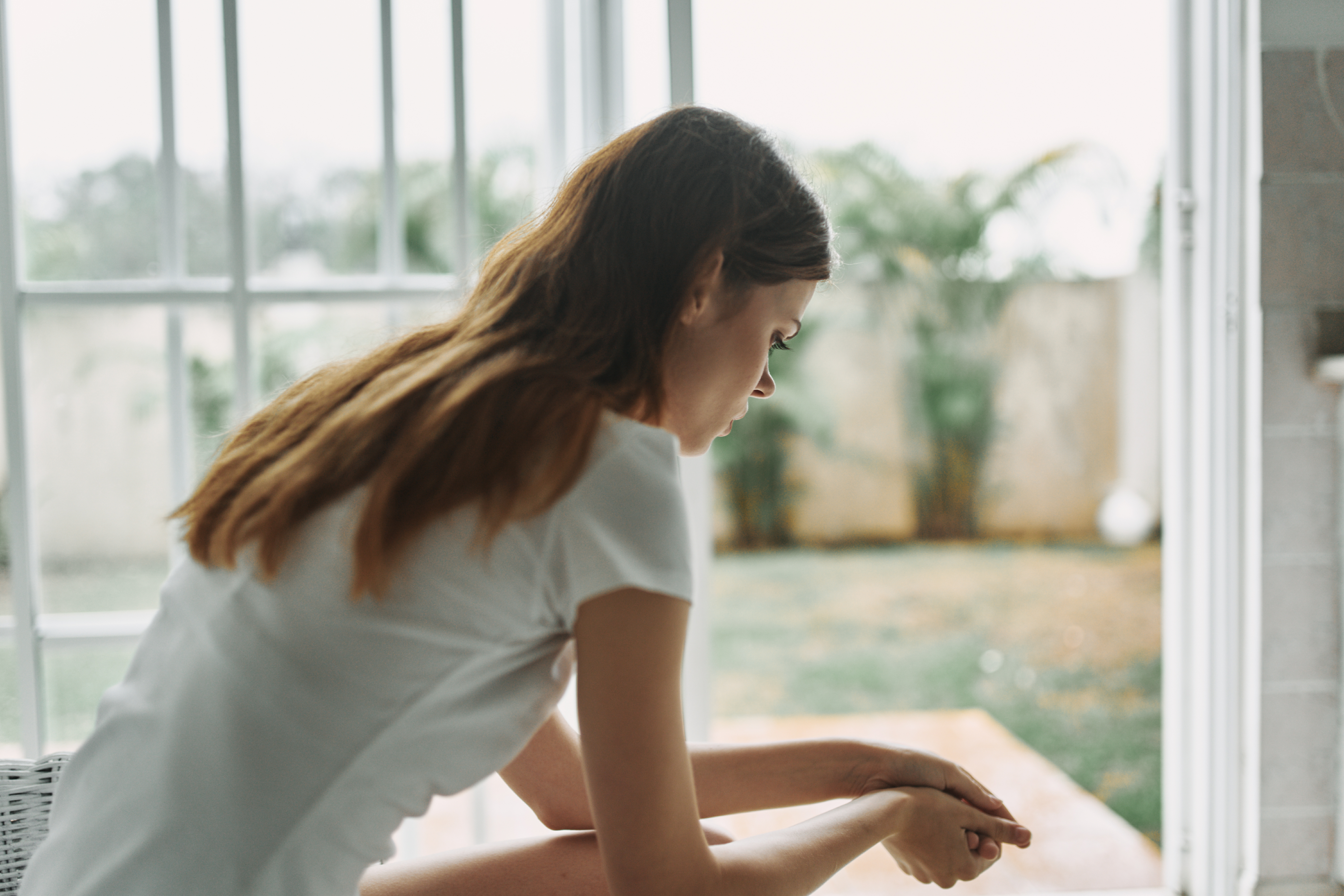 Woman sitting down looking sad