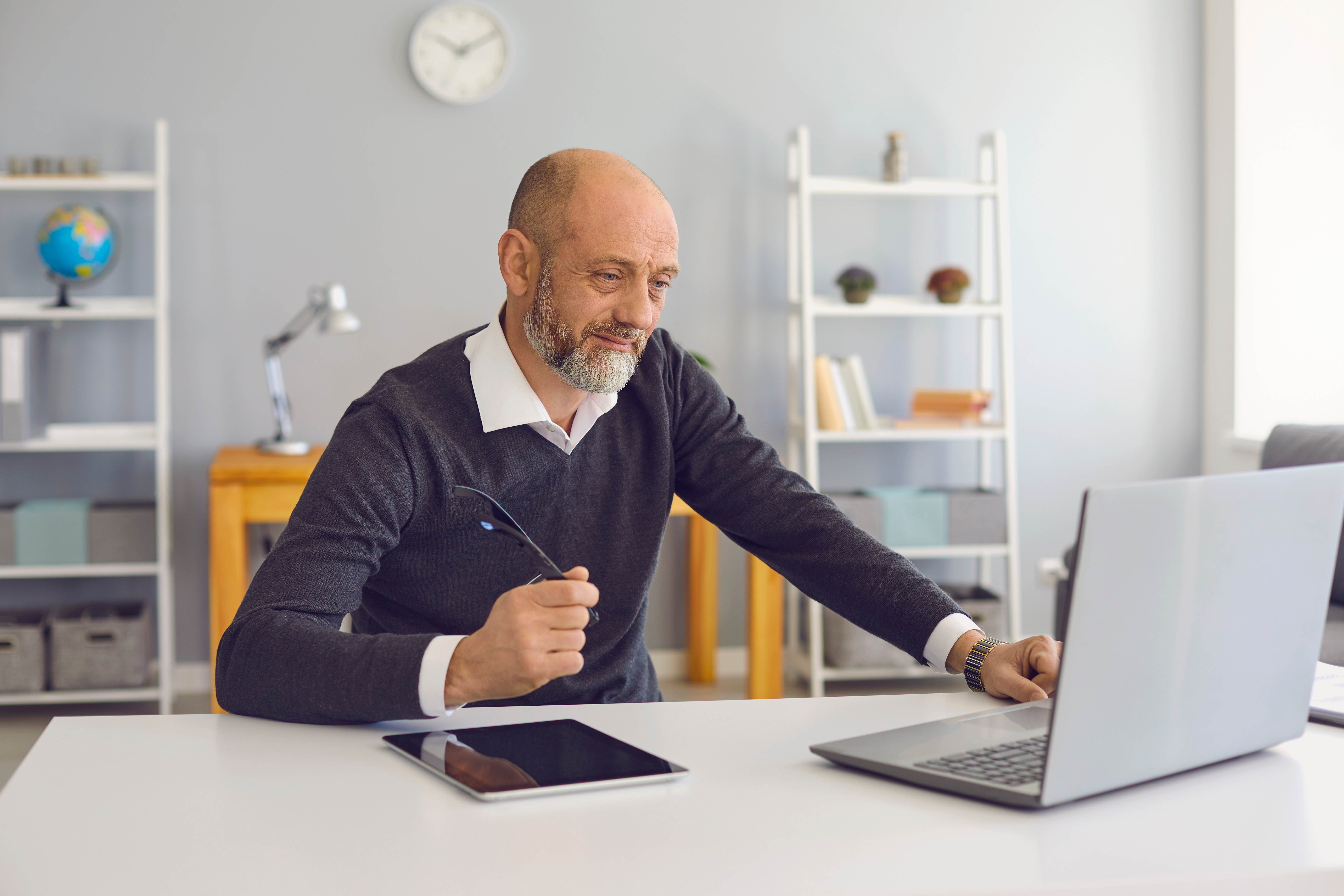 Man in office on laptop computer