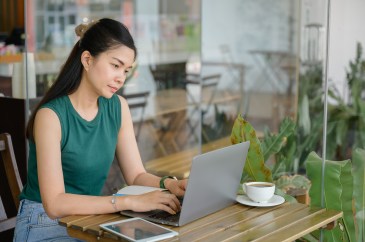 Woman looking annoyed at her computer screen