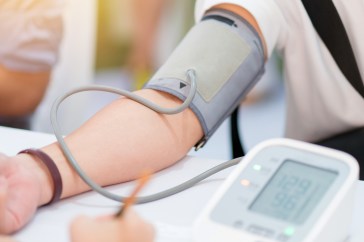 Someone getting blood pressure checked