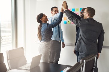 Employees high-fiving