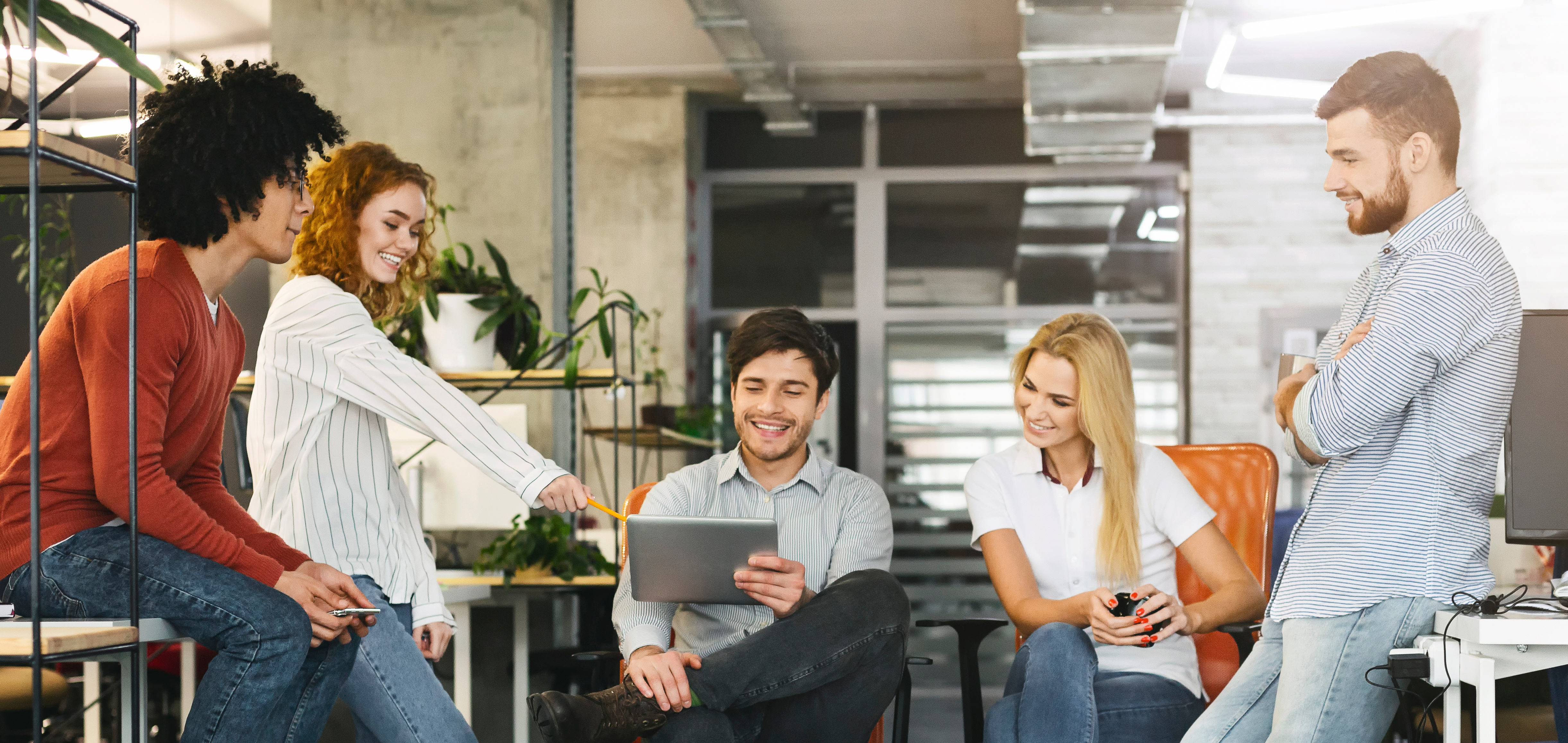 Team working together in an office, smiling