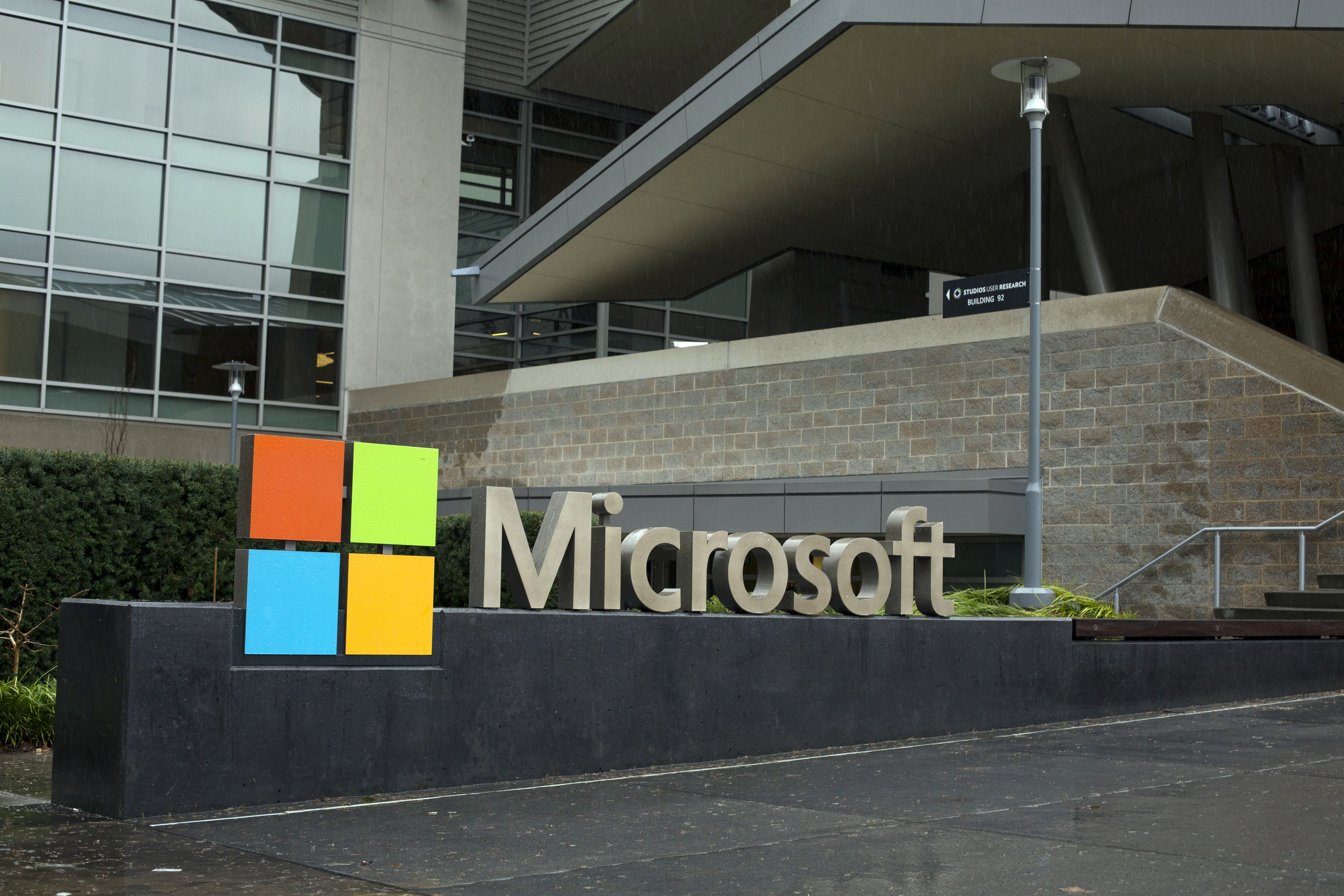 The outside of a Microsoft office, with the company's title and logo.