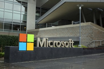 The outside of a Microsoft office, with the company's title and logo.