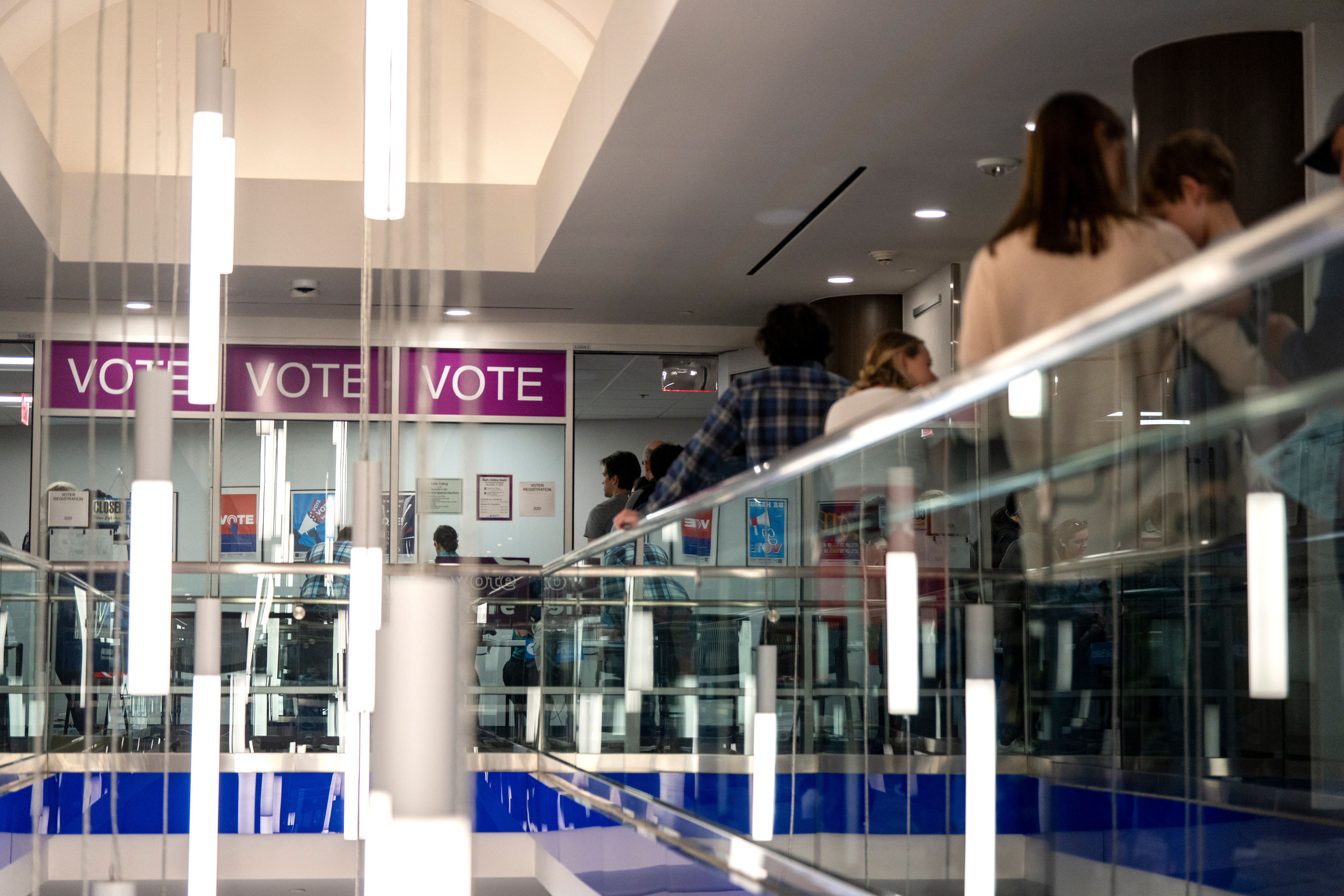 Voters wait in line to cast their ballot in Arlington, Virginia.