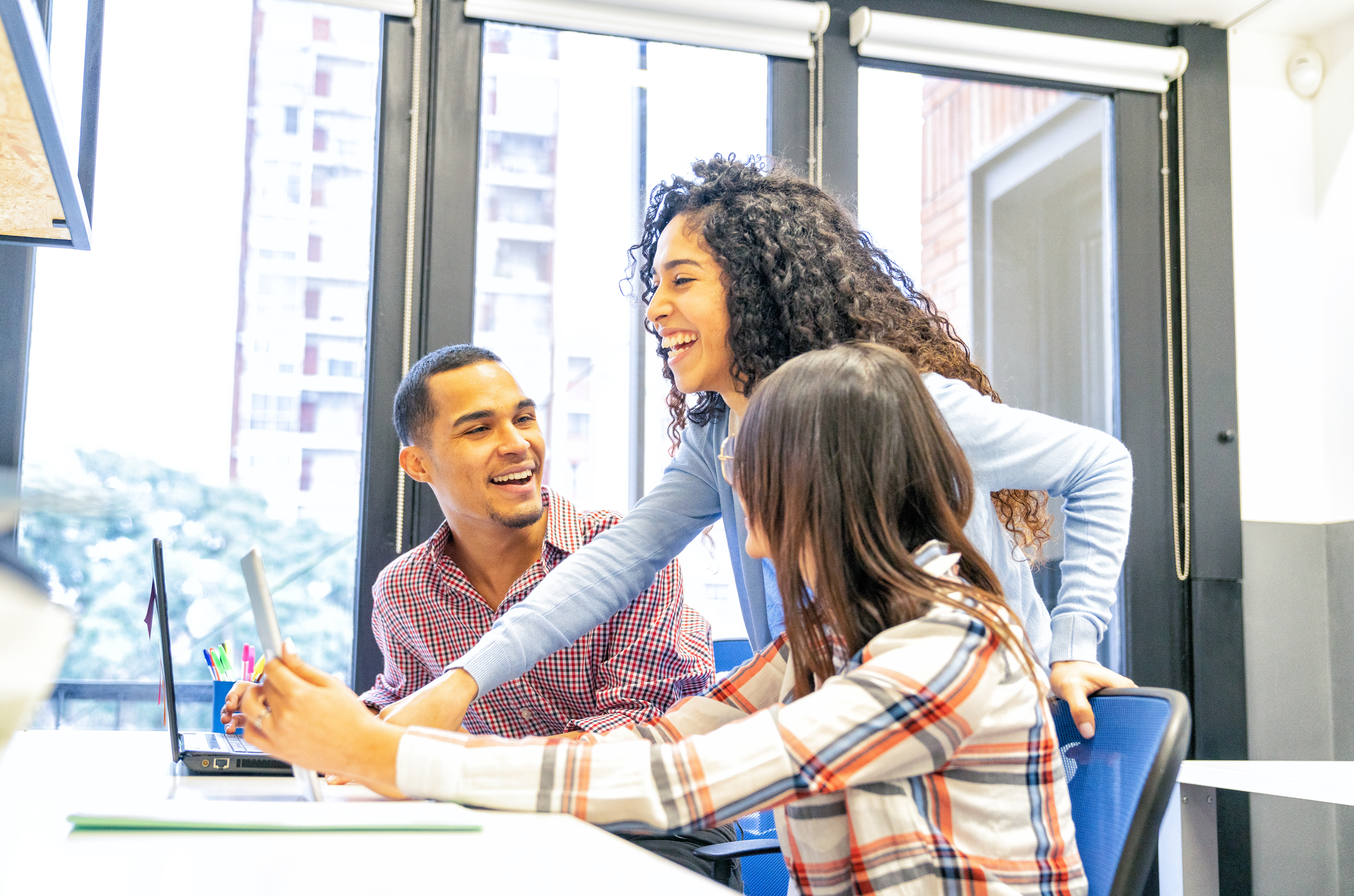Employees working together on computer