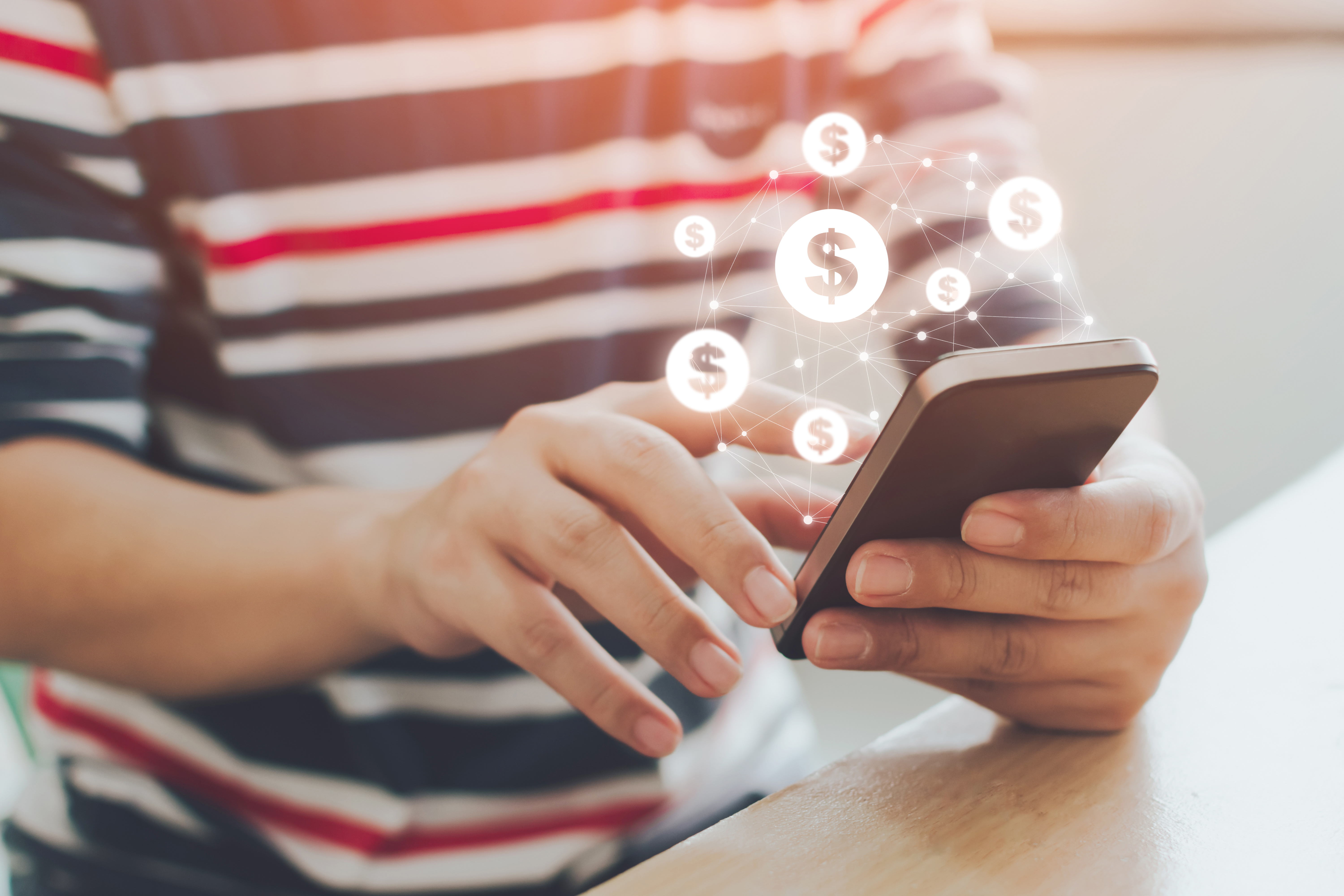 Person using phone for banking, money