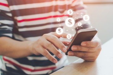 Person using phone for banking, money