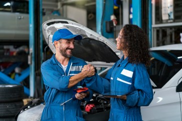 Two employees at car repair